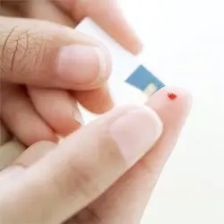 Blood Test Pin Prick on a Finger --- Image by © Royalty-Free/Corbis